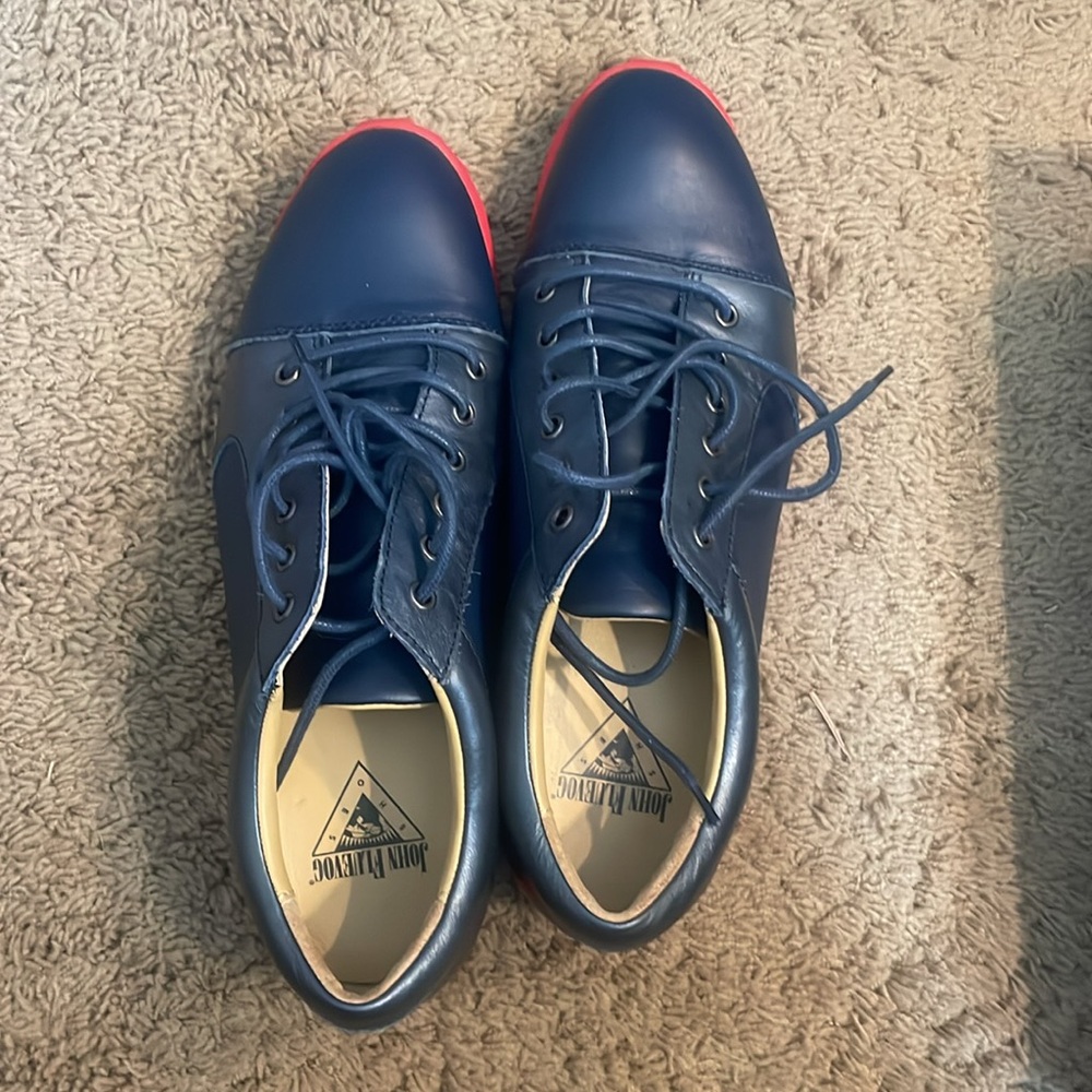Men’s oxfords. Size 10. Navy leather with red soles.